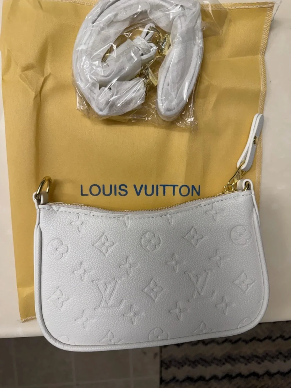 Louis Vuitton White Empreinte Mini Pochette with Gold Hardware - Picture 2 of 5